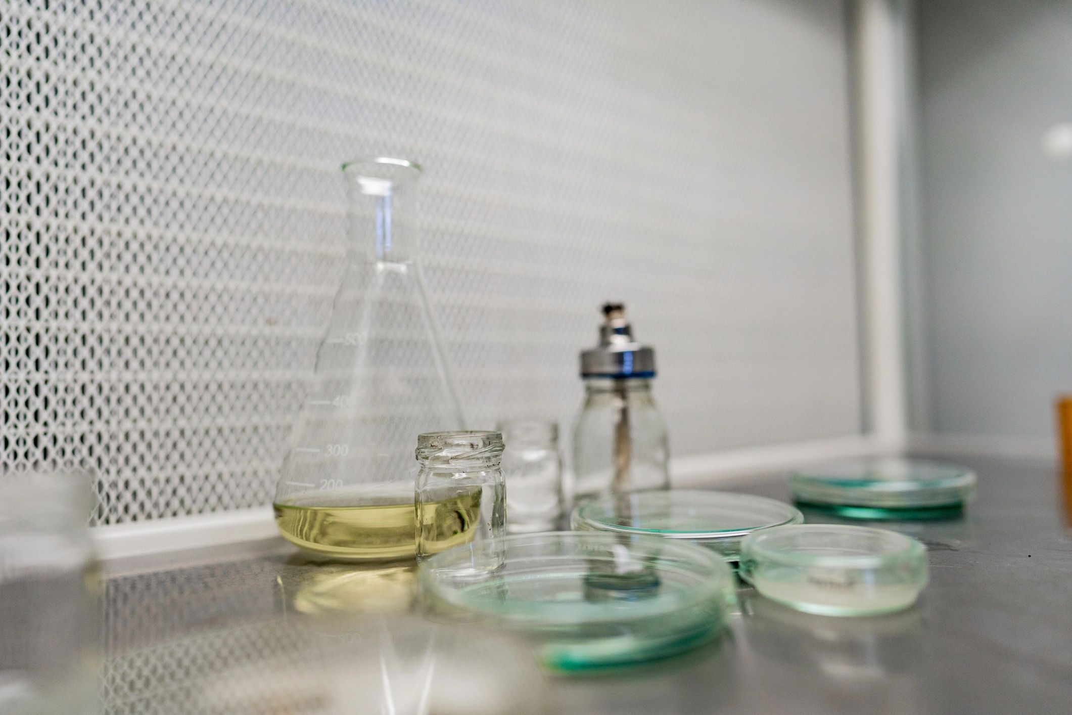 Laboratory bench with glassware and scientific instruments.